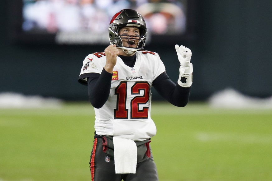 Tampa Bay Buccaneers quarterback Tom Brady reacts after winning the NFC championship NFL football game against the Green Bay Packers in Green Bay, Wis., Sunday, Jan. 24, 2021. The Buccaneers defeated  ...