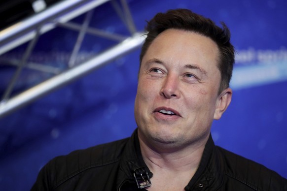 FILE - Tesla and SpaceX CEO Elon Musk arrives on the red carpet for the Axel Springer media award in Berlin on Dec. 1, 2020. For months, the Tesla and SpaceX CEO has expressed interest in creating his ...