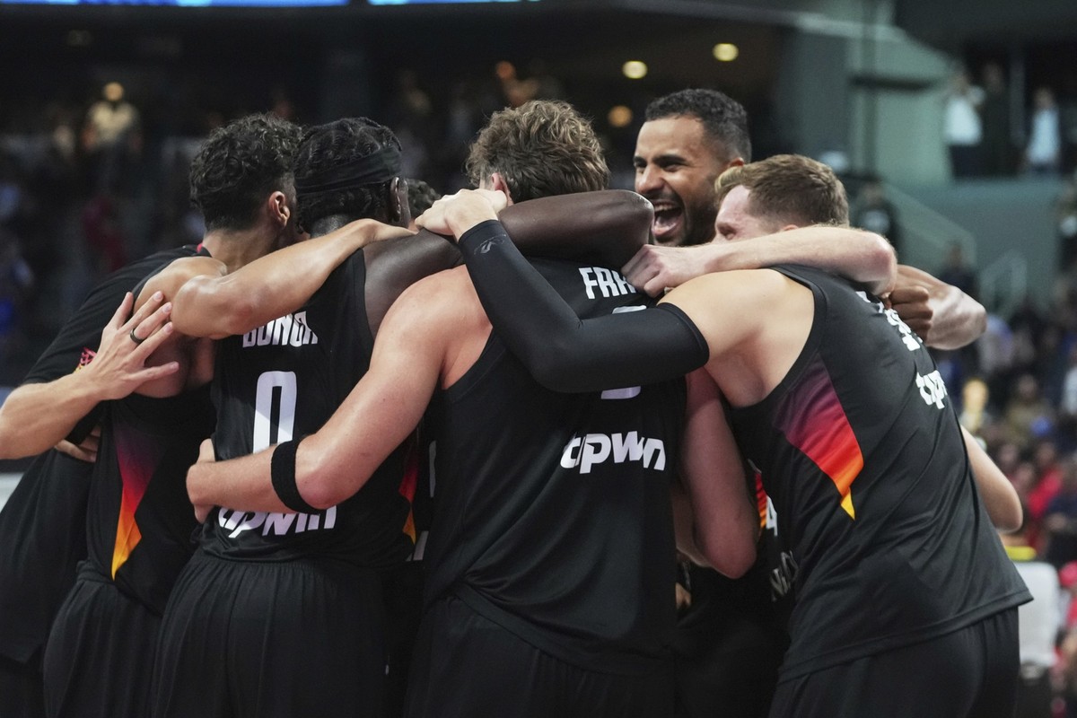 Germany players celebrate as they win the Eurobasket, European Basketball Championship final match between Turkey and Germany at the Riga Arena in Riga, Latvia, Sunday, Sept. 14, 2025. (AP Photo/Serge ...