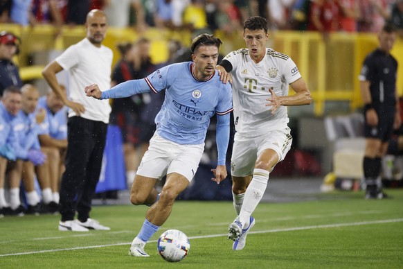 GREEN BAY, WI - JULY 23: Manchester City midfielder Jack Grealish 10 controls the ball ahead of Bayern Munich defender Benjamin Pavard 5 during a Club Friendly match on July 23, 2022 at Lambeau Field  ...