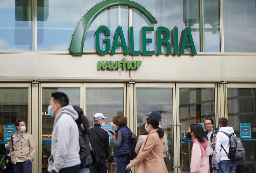 TRIER, GERMANY - SEPTEMBER 07: Branches of German department store chains Karstadt and Galeria Kaufhof stand opposite one another in a shopping street on September 7, 2018 in Trier, Germany. According ...