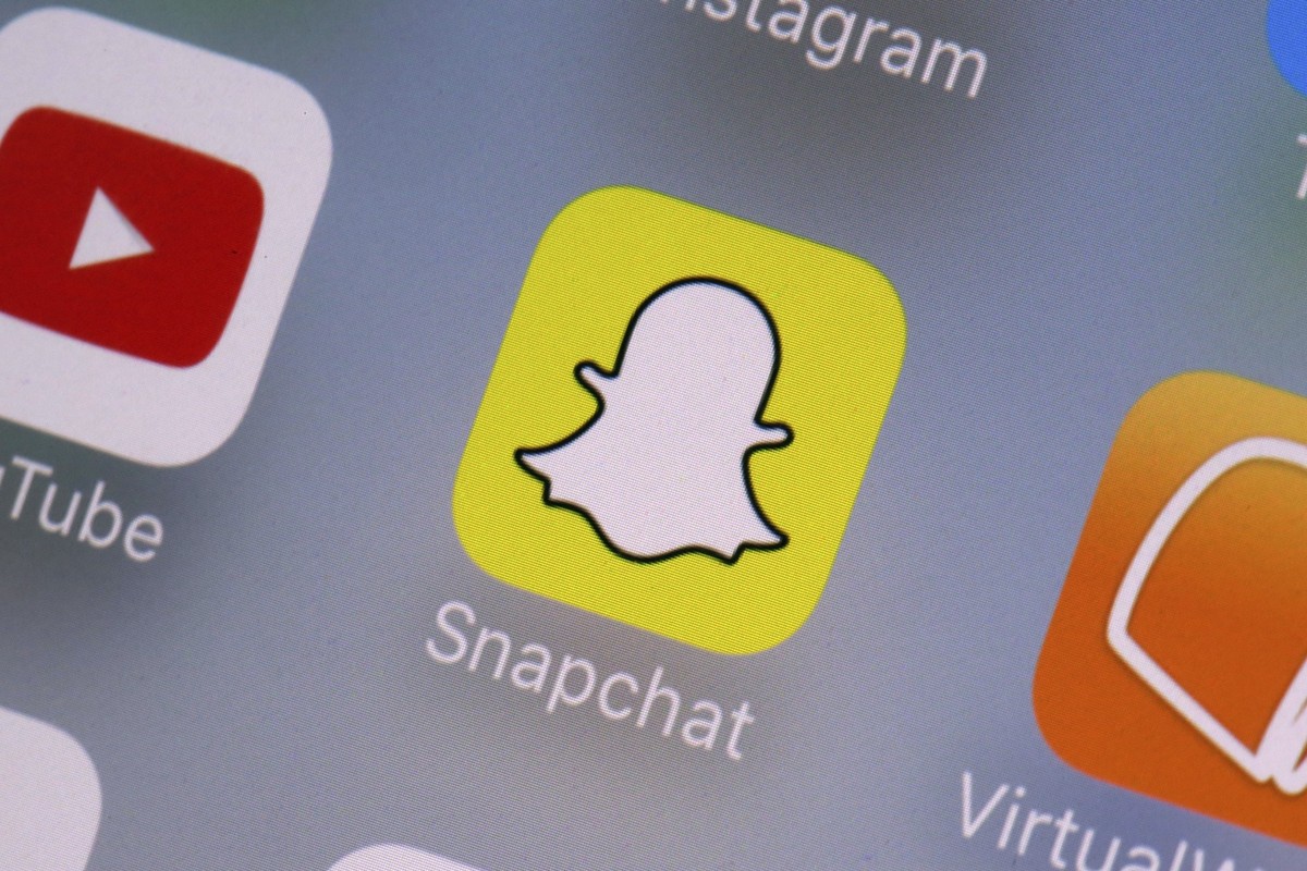 FILE - The Snapchat app on a mobile device is seen in New York. Snap Inc., Wednesday, Aug. 9, 2017. The owner of Snapchat will pay $15 million to settle a lawsuit brought by California’s civil rights  ...