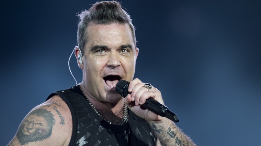 English singer Robbie Williams performs during the &quot;The Heavy Entertainment Show&quot; tour at the Letzigrund Stadium in Zurich, Switzerland, Saturday, September 2, 2017. (KEYSTONE/Ennio Leanza)  ...