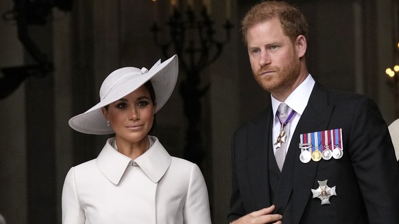 FILE - Prince Harry and Meghan Markle, Duke and Duchess of Sussex leave after a service of thanksgiving for the reign of Queen Elizabeth II at St Paul&#039;s Cathedral in London, Friday, June 3, 2022  ...