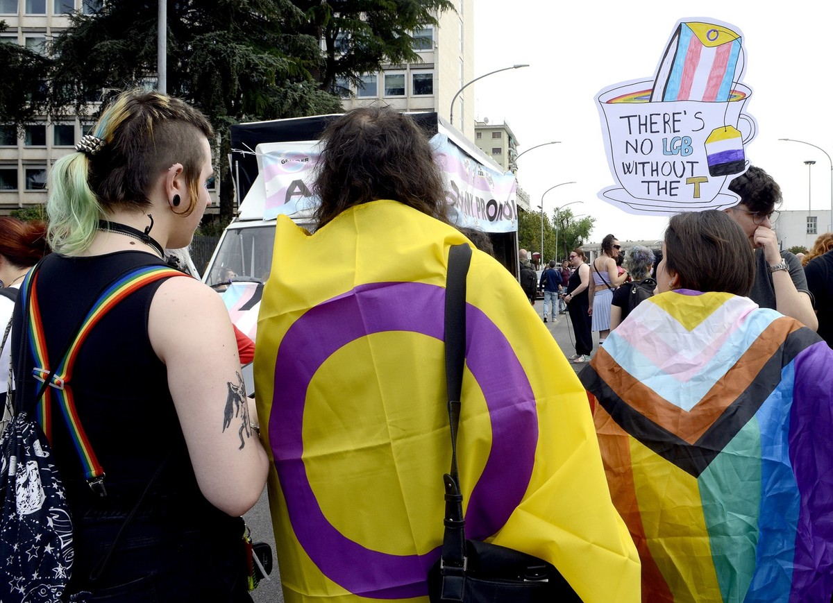 ROME, ITALY - MAY 18: People with LGBTQ+ flags and placards participate in the Demonstration on the occasion of the international day against homophobia, biphobia and transphobia for the self-determin ...