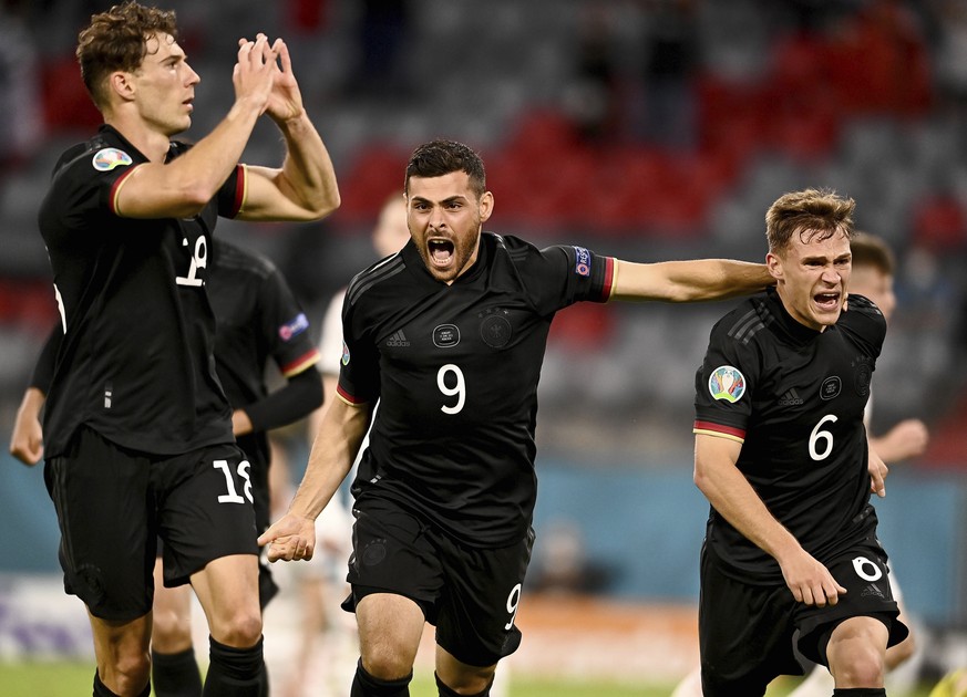 Germany's Leon Goretzka, left, celebrates with teammates after scoring his side's second goal during the Euro 2020 soccer championship group F match between Germany and Hungary at the Allianz Arena in ...