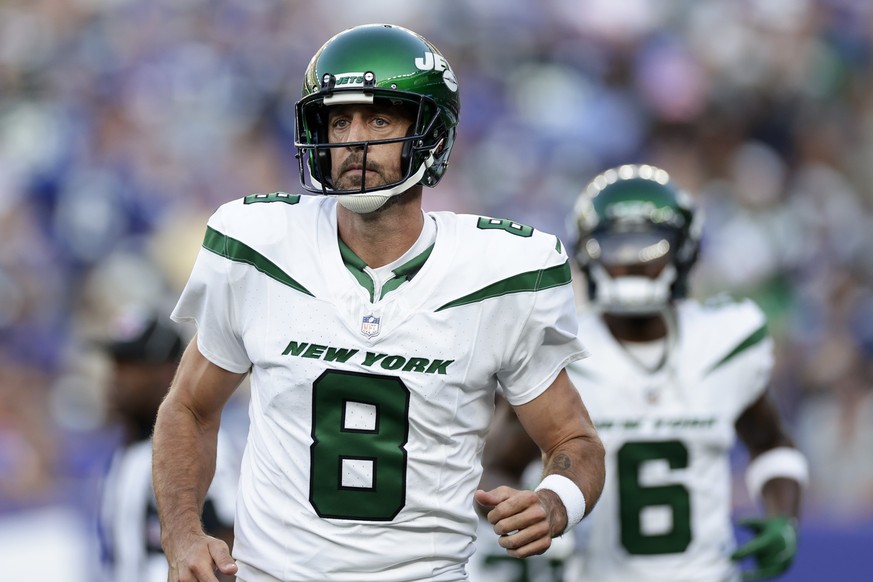 New York Jets quarterback Aaron Rodgers (8) runs the field during the first half of an NFL preseason football game against the New York Giants, Saturday, Aug. 26, 2023, in East Rutherford, N.J. (AP Ph ...