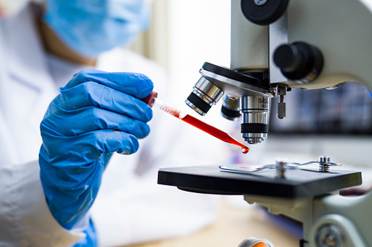 Scientist working with blood sample in laboratory
