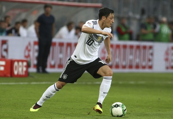 Germany's Mesut Ozil runs with the ball during a friendly soccer match between Austria and Germany in Klagenfurt, Austria, Saturday, June 2, 2018. (AP Photo/Ronald Zak)