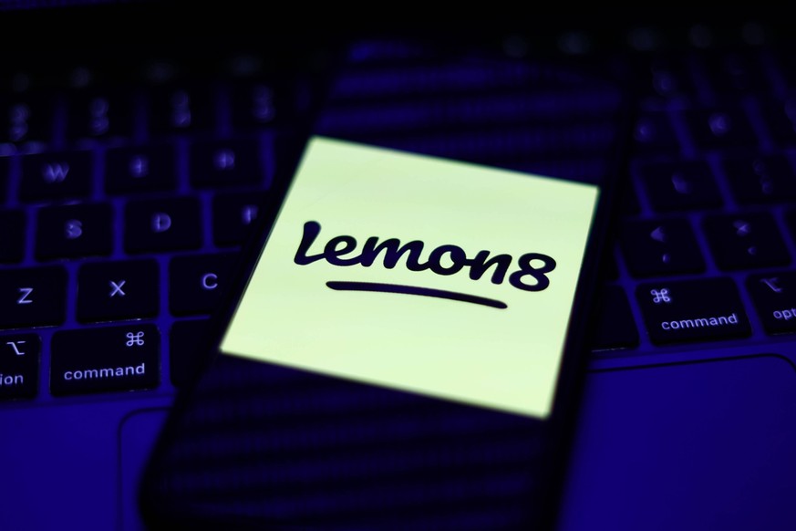 Lemon8 Photo Illustrations A laptop keyboard and Lemon8 logo displayed on a phone screen are seen in this illustration photo taken in Krakow, Poland on March 30, 2023. Krakow Poland PUBLICATIONxNOTxIN ...