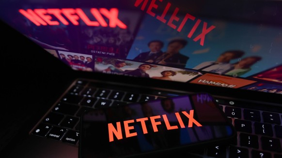 Netflix And Microsoft Photo Illustrations Netflix logo displayed on a phone screen and Netflix website displayed on a laptop screen are seen in this illustration photo taken in Krakow, Poland on July  ...