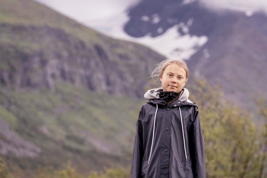 Climate activist Greta Thunberg poses for a photo backdropped by the Ahkka mountain at the world heritage site of the Laponia area in Sapmi, Sweden, on Tuesday July 13, 2021. (Carl-Johan Utsi / TT via ...