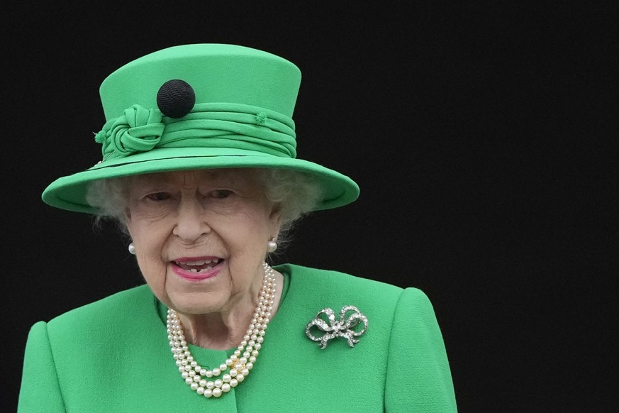 FILE - Queen Elizabeth II stands on the balcony during the Platinum Jubilee Pageant at the Buckingham Palace in London, Sunday, June 5, 2022, on the last of four days of celebrations to mark the Plati ...