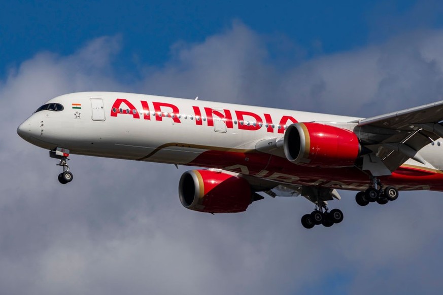 Air India Airbus A350-900 aircraft spotted flying for landing at the runway of London Heathrow Airport LHR in the United Kingdom. The modern and advanced wide body airplane has the registration tail n ...