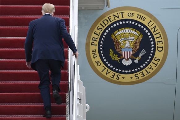 President Donald Trump walks up the steps of Air Force One at Andrews Air Force Base in Md., Tuesday, May 5, 2020. Trump is heading to Arizona and is expected to tour Honeywell International&#039;s ma ...