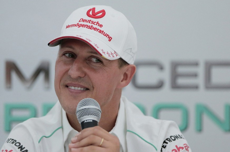 FILE - Michael Schumacher announces his retirement from Formula One during a press conference at the Suzuka Circuit venue for the Japanese Formula One Grand Prix in Suzuka, Japan, Oct. 4, 2012. The fa ...