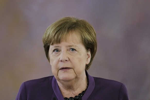 Former German Chancellor Angela Merkel speaks after she received the Grand Cross of the Order of Merit of the Federal Republic of Germany in a special design from German President Frank-Walter Steinme ...