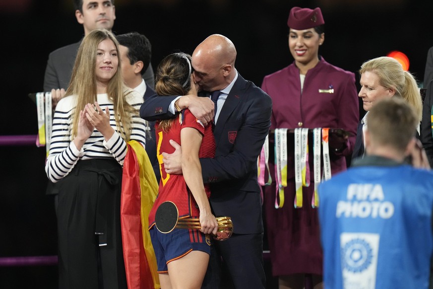 President of Spain&#039;s soccer federation, Luis Rubiales, right, hugs Spain&#039;s Aitana Bonmati on the podium following Spain&#039;s win in the final of Women&#039;s World Cup soccer against Engla ...