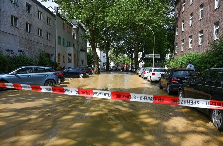 A flooded street is seen after storm &quot;Lambert&quot; hit the city of Dortmund, western Germany, on June 23, 2023. (Photo by Ina FASSBENDER / AFP) (Photo by INA FASSBENDER/AFP via Getty Images)