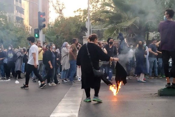 October 20, 2022, Tehran, Iran: A picture obtained by ZUMA outside Iran, reportedly shows protesters set fire as they clash with police during a protest over the death of young Iranian woman Mahsa Ami ...