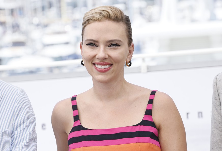 FILE - Scarlett Johansson poses for photographers at the photo call for the film &quot;Asteroid City&quot; at the 76th international film festival in Cannes, southern France, May 24, 2023. Johansson a ...