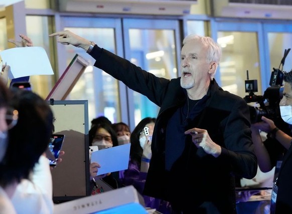 Director James Cameron is greeted by fans during the blue carpet event to promote his latest movie &#039;Avatar: The Way of Water&#039; in Seoul, South Korea, Friday, Dec. 9, 2022. The movie is to be  ...