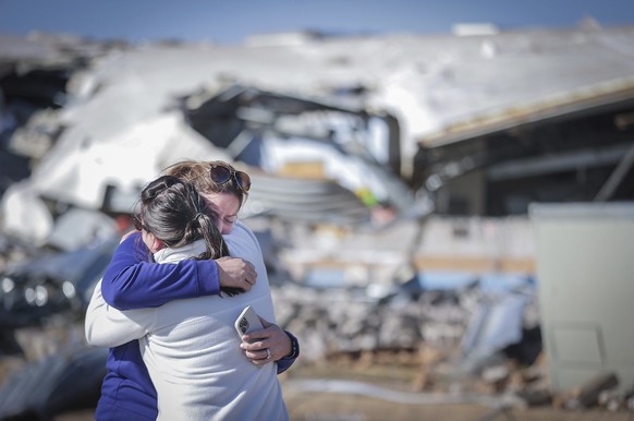 Crestview Elementary School teachers Anna Vandiver, left, and Elizabeth Woddell share a hug while visiting the mangled wreckage of their classrooms Saturday, April 1, 2023 after a tornado ripped throu ...