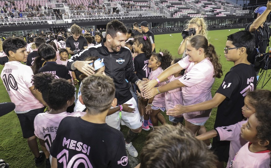IMAGE DISTRIBUTED FOR HARD ROCK INTERNATIONAL - Kids from the local community gather around soccer sensation Leo Messi at &quot;The Hard Rock Messi Kids Menu&quot; launch event at DRV PNK Stadium on O ...