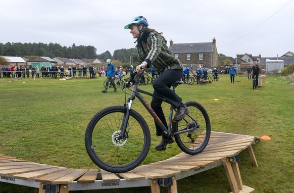 Britain&#039;s Kate, Princess of Wales, known as the Duchess of Rothesay when in Scotland, rides a bike during a visit to Outfit Moray, an award-winning charity delivering life-changing outdoor learni ...