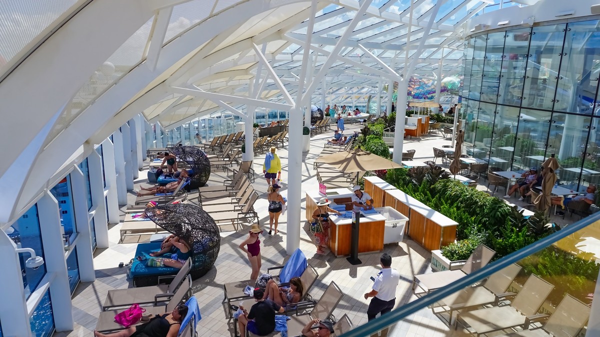 Miami, USA - April 29, 2022: People having fun at pools, bars, entertainment and innovative activities at Symphony of the seas is the biggest cruise ship at Miami, USA on April 29, 2022