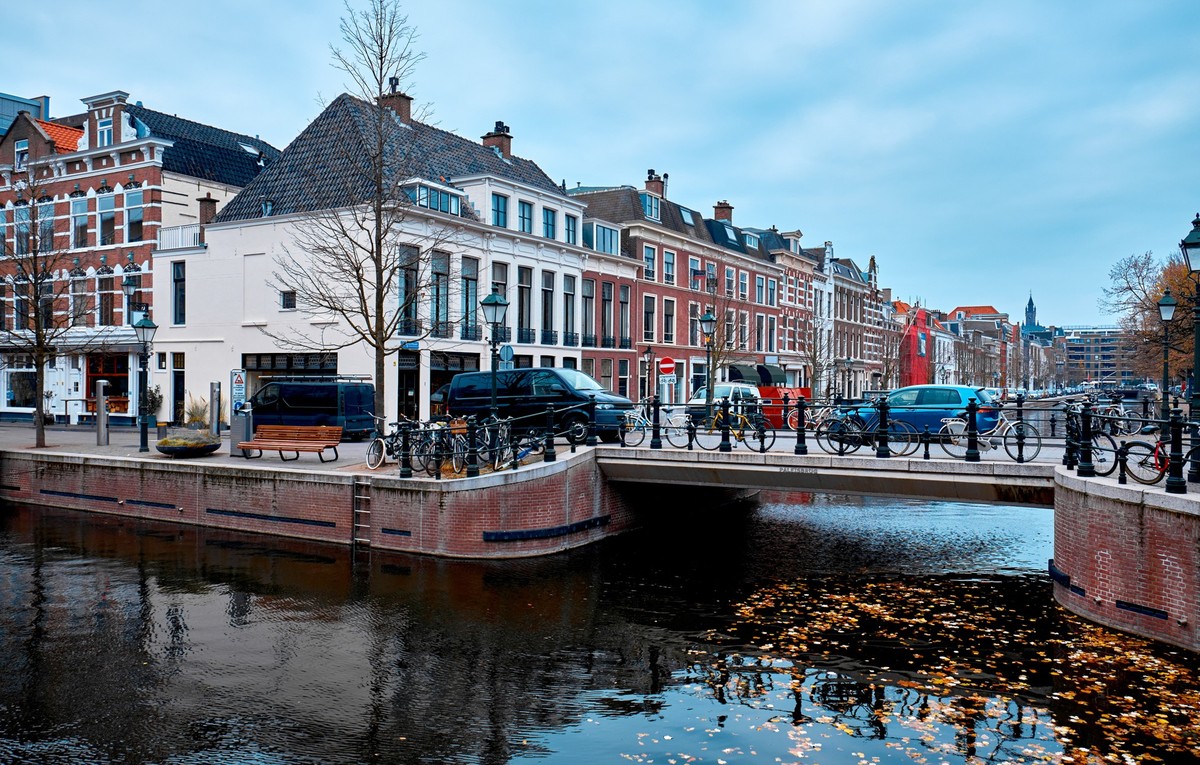 City landscape. View of a building and a bridge over a canal in The Hague, Netherlands.