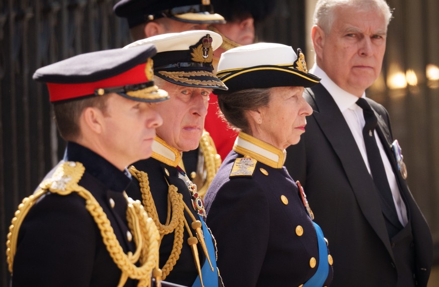 LONDON, ENGLAND - SEPTEMBER 19: King Charles III, Anne, Princess Royal and Prince Andrew, Duke of York watch on as The Queen&#039;s funeral cortege borne on the State Gun Carriage of the Royal Navy as ...