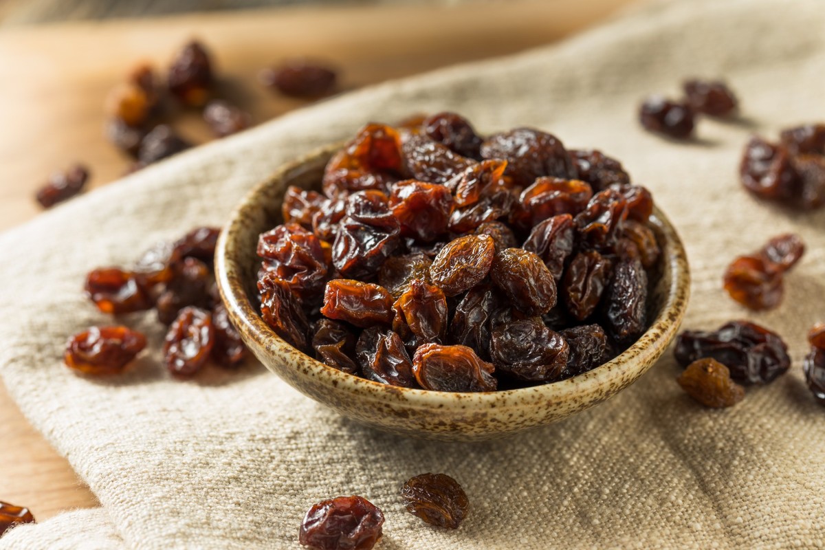 Organic Dried Brown Raisins in a Bowl