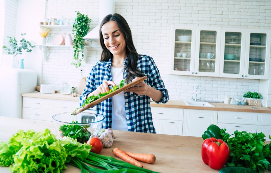 Healthy Food. Vegan Salad. Diet. Dieting Concept. Healthy Lifestyle. Cooking At Home. Prepare Food. Cutting ingredients on table