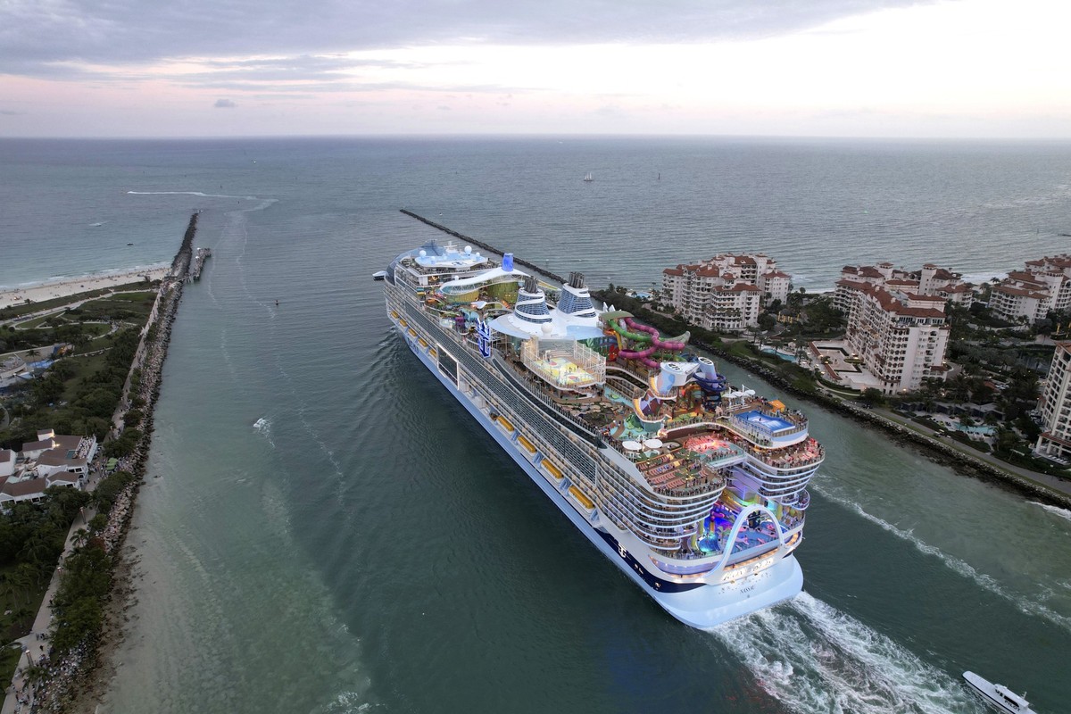 Icon of the Seas, the world's largest cruise ship, sails out of Government Cut between Fisher Island, right, and Miami Beach, Fla., as it departs PortMiami on its first public cruise, Saturday, J ...