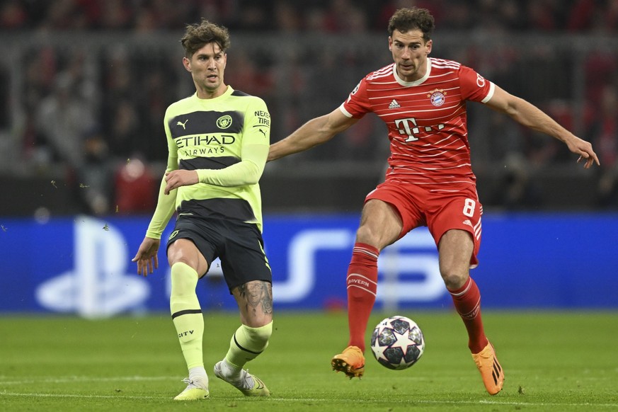 Manchester City&#039;s John Stones, left, duels for the ball with Bayern&#039;s Leon Goretzka during the Champions League quarter finals second leg soccer match between Bayern Munich and Manchester Ci ...