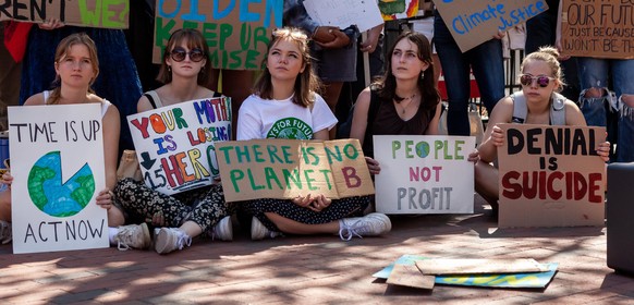 Students rally at the White House during Fridays for Futureâs Earth Day climate strike. Demonstrators demanded that the Biden Administration cease investment in and construction of fossil fuel infra ...