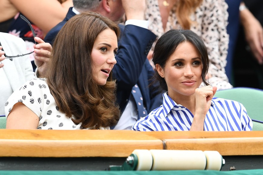 LONDON, ENGLAND - JULY 14: Catherine, Duchess of Cambridge and Meghan, Duchess of Sussex attend day twelve of the Wimbledon Lawn Tennis Championships at All England Lawn Tennis and Croquet Club on Jul ...