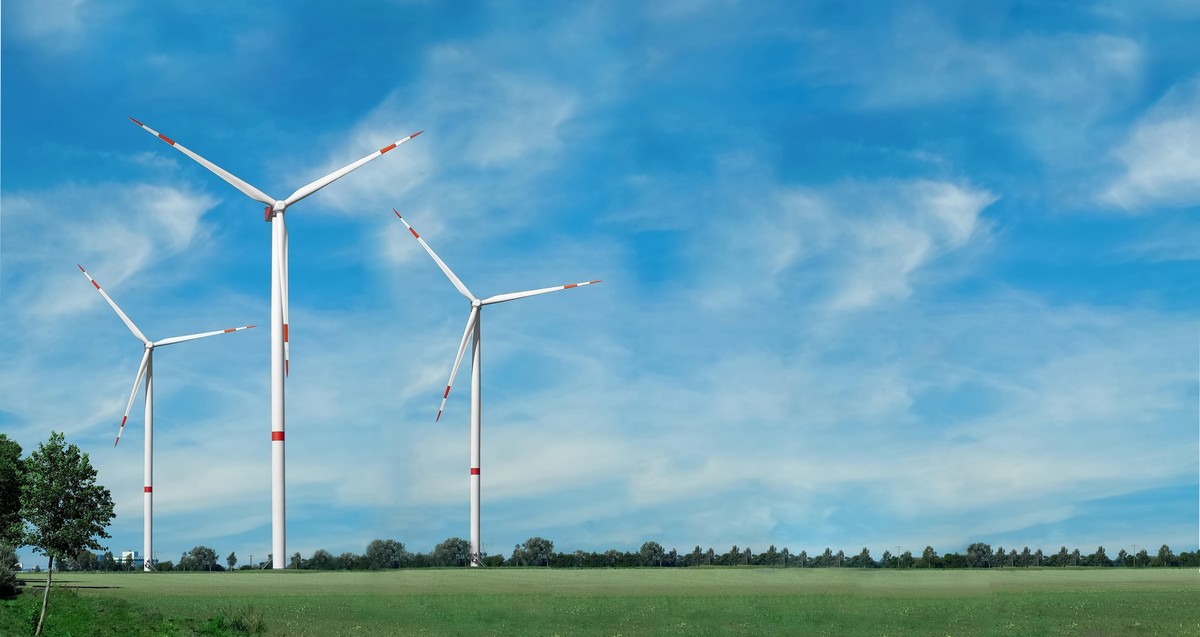 Renewable energy banner. Wind generator in nature background, landscape format for banner advertising. Green energy and electricity concept