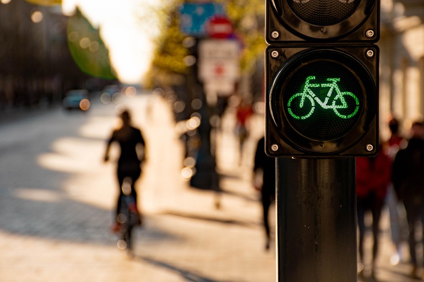 Sustainable transport. Bicycle traffic signal, green light, road bike, free bike zone or area, bike sharing