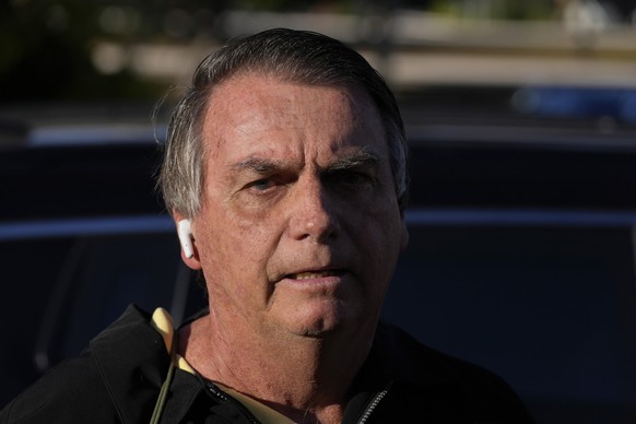 Brazil&#039;s former President Jair Bolsonaro speaks to the media upon arriving at the airport in Brasilia, Brazil, Thursday, June 29, 2023. Bolsonaro is being judged by Supreme Electoral Court judges ...