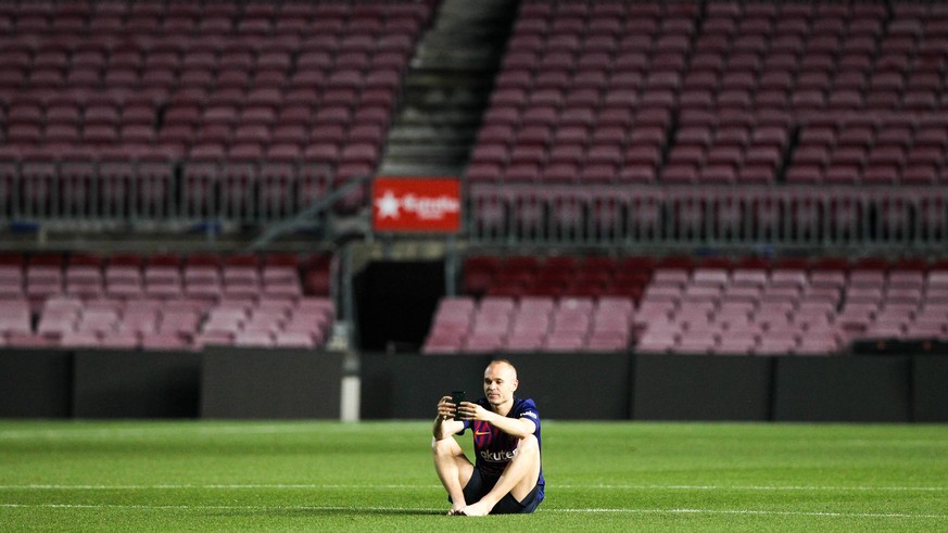 20th May 2018, Camp Nou, Barcelona, Spain; La Liga football, Barcelona versus Real Sociedad; Andres Iniesta of FC Barcelona Barca sits alone in the middle of the pitch after the game finished long ago ...