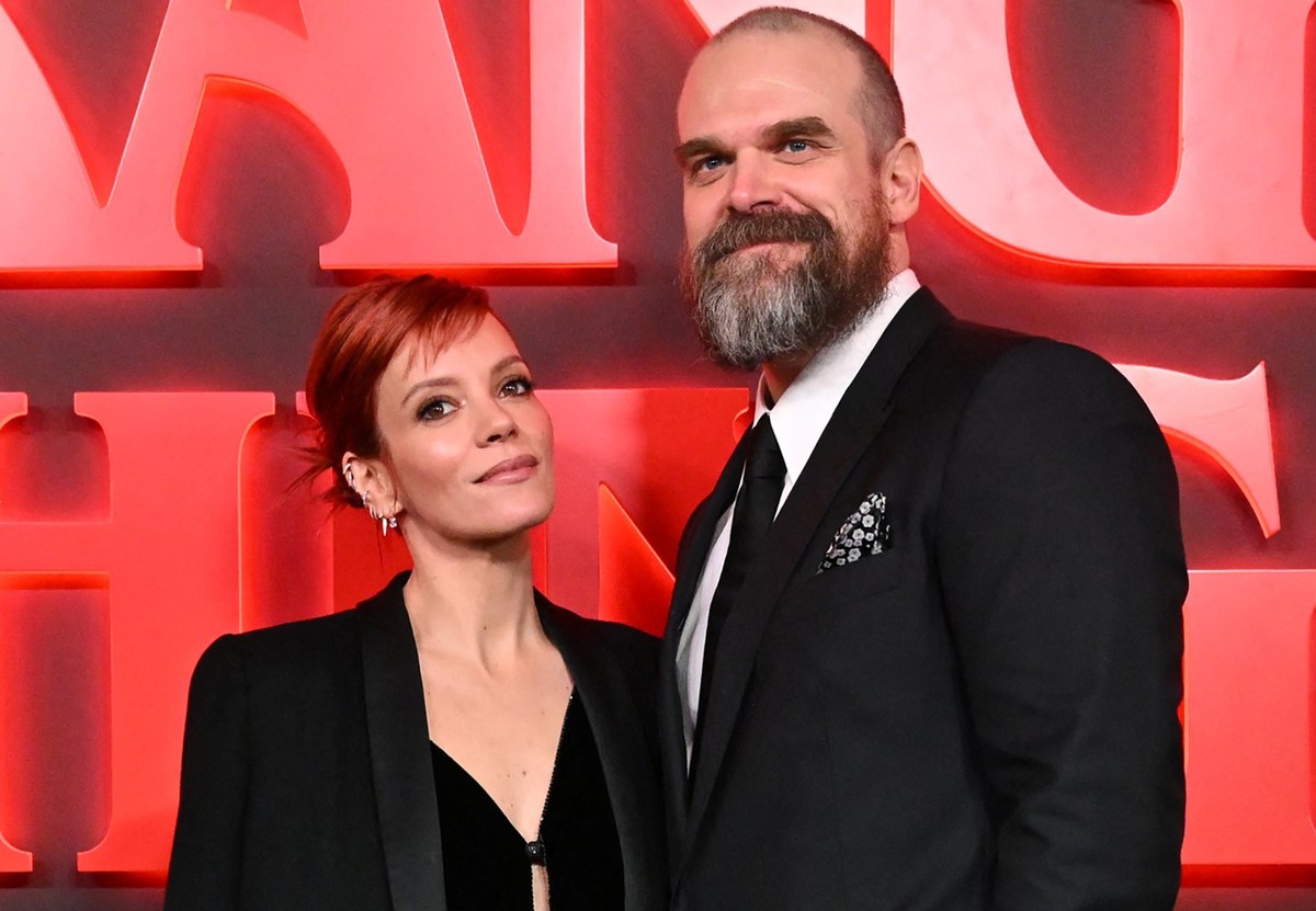 British singer Lily Allen and US actor David Harbour pose on the red carpet upon arrival to attend the West End world premiere of "Stranger Things: The Last Shadow" stage play at the Phoenix ...