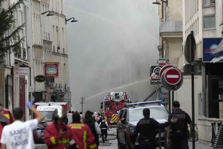 Firemen use a water canon as they fight a blaze Wednesday, June 21, 2023 in Paris. Firefighters fought a blaze on Paris&#039; Left Bank that is sent smoke soaring over the domed Pantheon monument and  ...