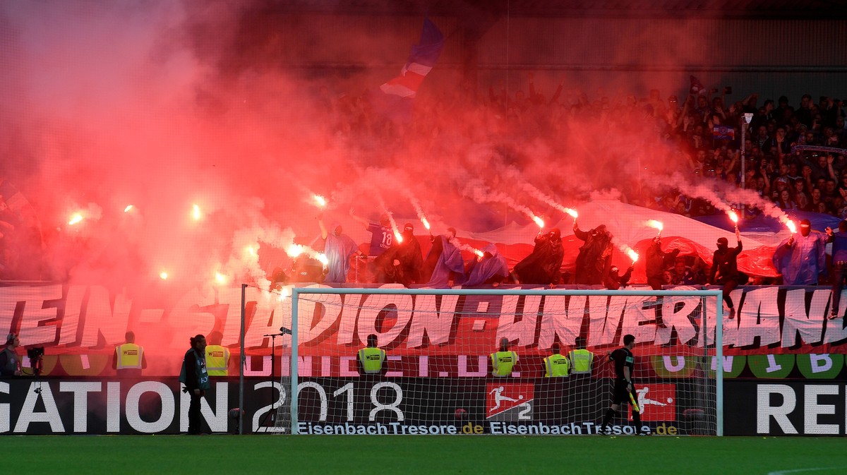 Soccer Football - Bundesliga Promotion/Relegation Playoff Second Leg - Holstein Kiel vs VfL Wolfsburg - Holstein-Stadion, Kiel, Germany - May 21, 2018 Holstein Kiel fans light flares before the match  ...
