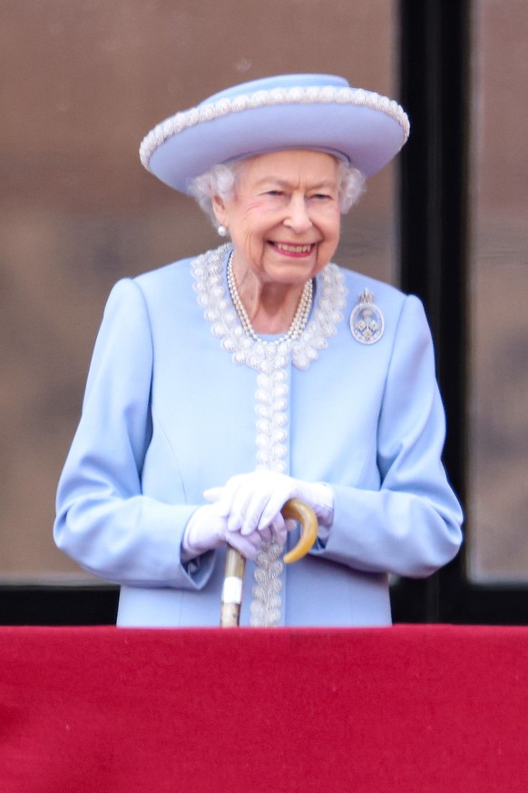 Platinum Jubilee. Queen Elizabeth II smiles as she watches from the balcony at Buckingham Palace for the Trooping the Colour ceremony at Horse Guards Parade, central London, as the Queen celebrates he ...