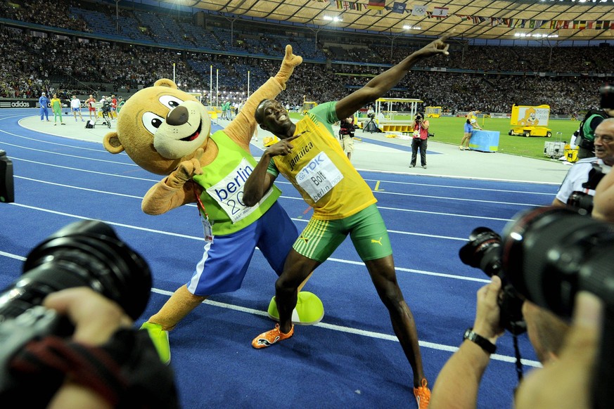 - BERLIN, GERMANY: Jamaican Usain Bolt and Berlino the mascotte do the typical Bolt move, after Bolt won the men s 200m final at the 12th IAAF World Championships of Athletics in the Olympic Stadium o ...