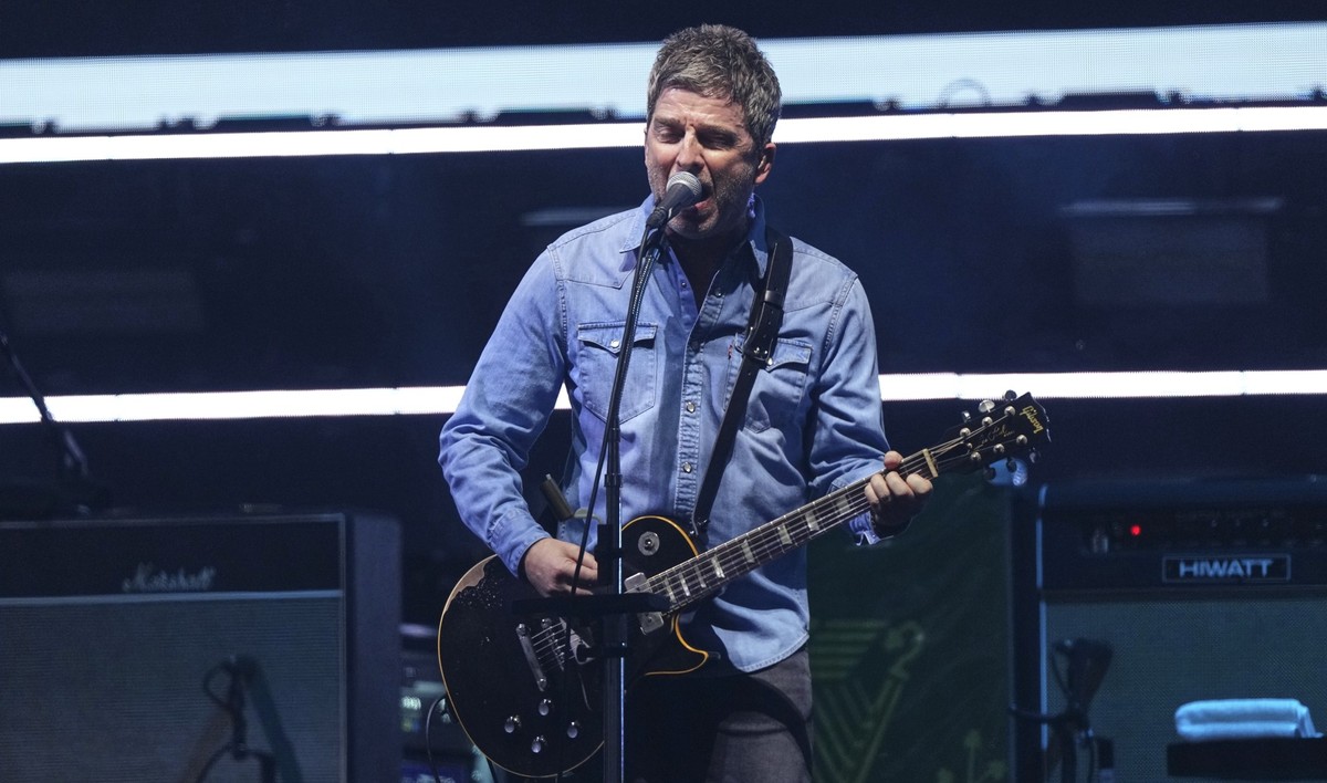 Noel Gallagher from the band Oasis performs during their reunion concert on Friday, July 4, 2025, in Cardiff. (Photo by Scott A Garfitt/Invision/AP)