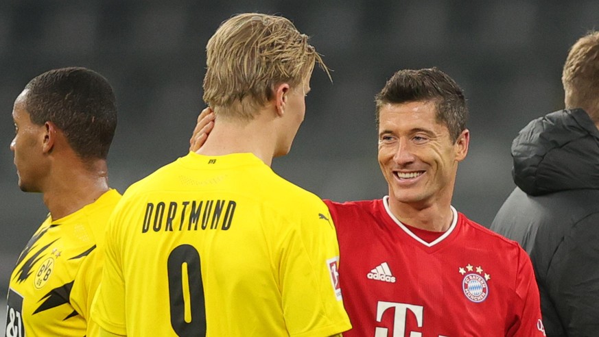 DORTMUND, GERMANY - NOVEMBER 07: Erling Haaland of Dortmund and Robert Lewandowski of Muenchen chat after the Bundesliga match between Borussia Dortmund and FC Bayern Muenchen at Signal Iduna Park on  ...