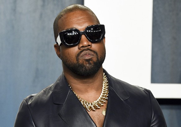 FILE - Kanye West arrives at the Vanity Fair Oscar Party on Feb. 9, 2020, in Beverly Hills, Calif. West, who goes by Ye, is ending the contract between his company Yeezy and the struggling clothing re ...